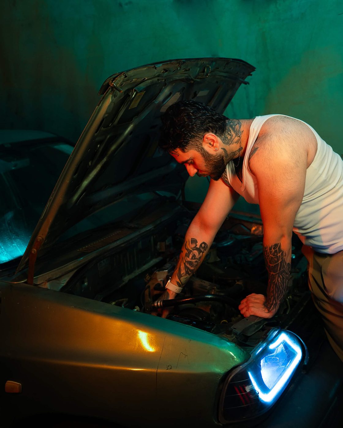 Working on a car engine, behind the scenes